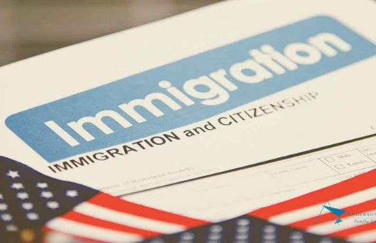 The image shows a document that reads, “ Immigration and citizenship” with an American flag underneath